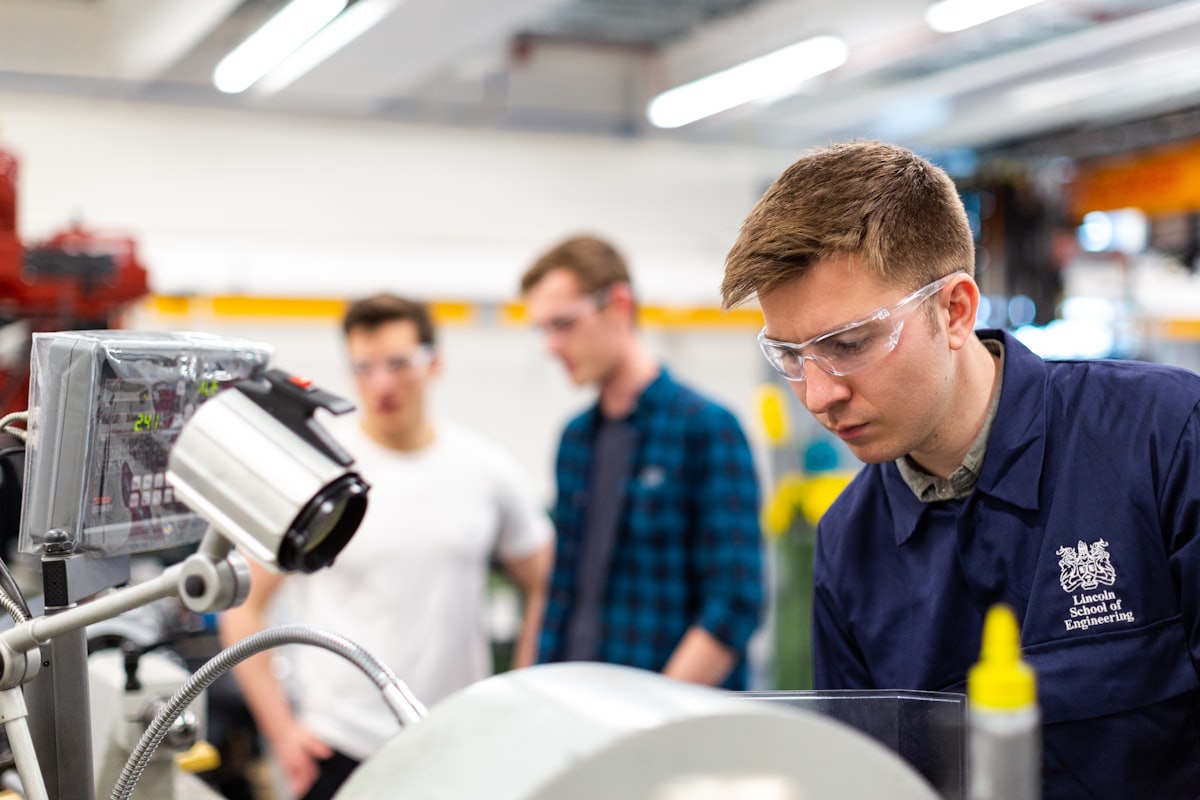 Young apprentice learning on the job with a mentor