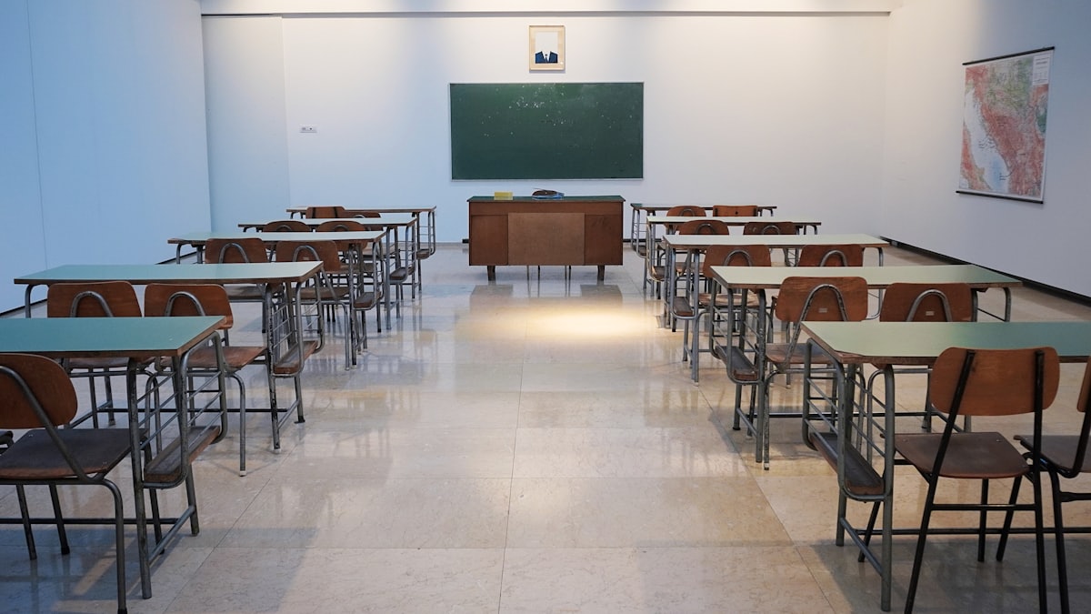 School students working in a bright classroom